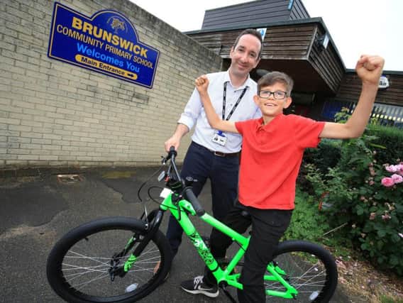 Archie Bamforth, aged 11, with headteacher at Brunswick Community Primary Neil Frankland.