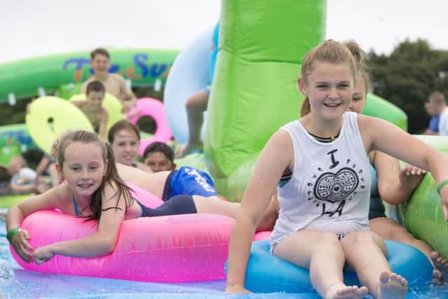 Some youngsters were able to use the slide, despite reports of low water pressure leading to lengthy queues