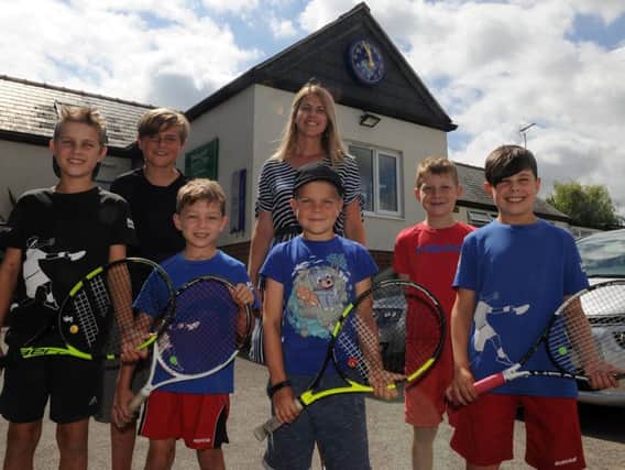 Chair Sarah Everest with children from Beauchief Tennis Club which started in 1938