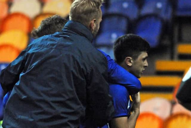 Fernando Forestieri is ushered away by team mates after a melee at the end of Wednesday's friendly with Mansfield Town