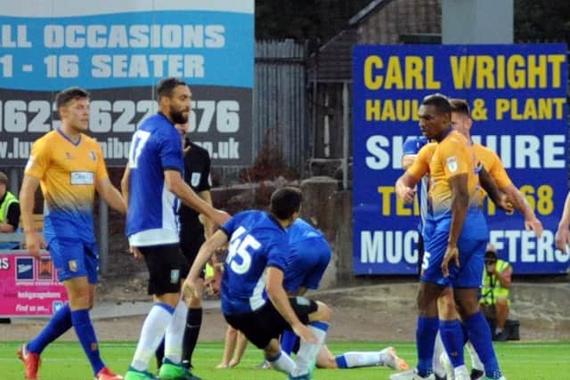 Fernando Forestieri gets involvved in an altercation with Mansfield's Krystian Pearce
