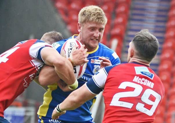 Dons Jack Downs is pictured in action against Oldham. Photo: Marie Caley