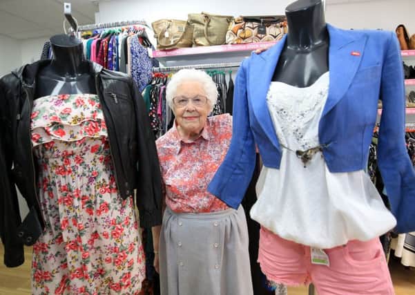 Charity shop festival fashion at Age UK on Norfolk Row. Pictured is shop volunteer Sheila Mettam.