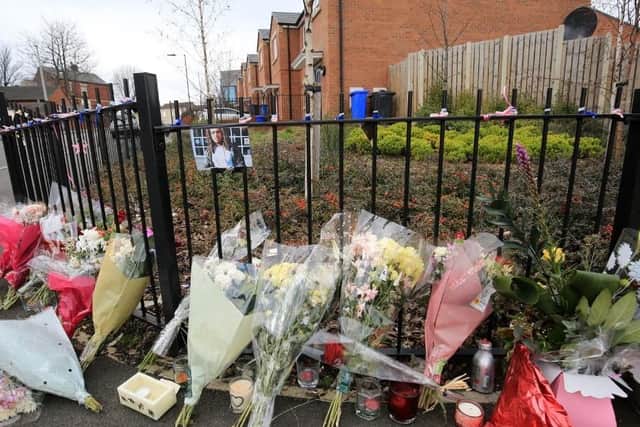 Flowers at the spot where Jarvin Blake was stabbed to death in Burngreave, Sheffield