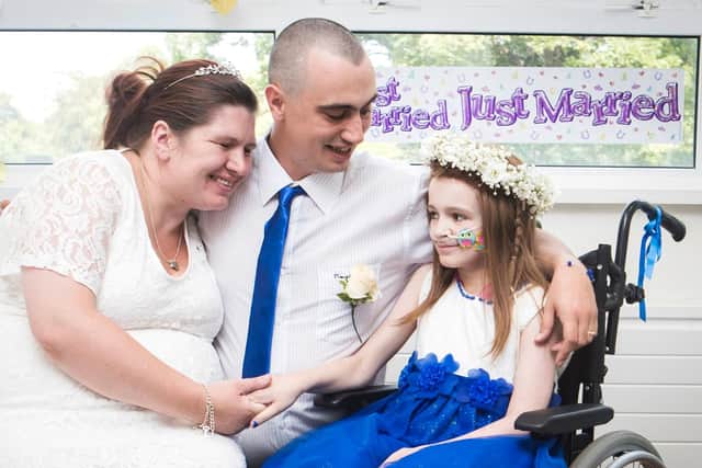 Cancer patient Kayleigh Walsh (right) with her parents Lyndsey and Paul Walsh, following their wedding blessing ceremony at Sheffield Children's Hospital (Picture: Danny Lawson/PA Wire)