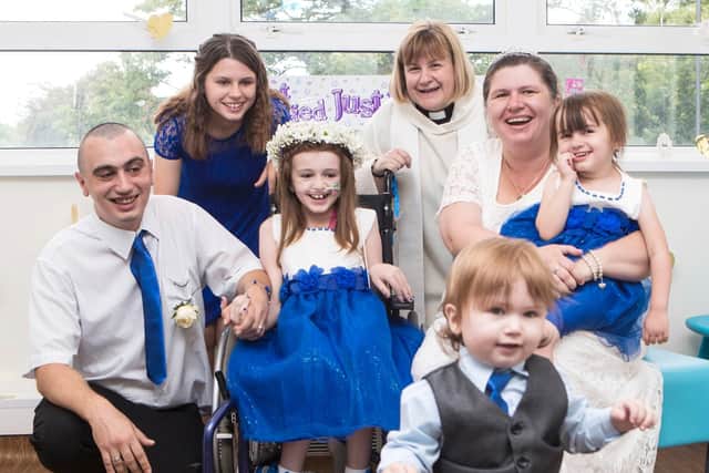 Cancer patient Kayleigh Walsh (centre) with her parents Lyndsey and Paul Walsh, her three siblings and hospital chaplain Claire Williams (Picture: Danny Lawson/PA Wire)