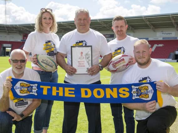 Chris Dungworth (Business Doncaster), Lorna Reeve (visit Doncaster ), Carl Hall  (Doncaster RLFC), Dean Wiffen (Doncaster council), Ben Lewis (keepmoat stadium) with the Rugby League World Cup bid. PIcture: Dean Atkins