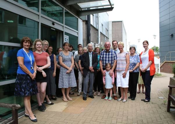 Inspirational cancer survivor, John Price, 64, of Sandygate (fifth from right) with family and  the team at Weston Park Hospital
