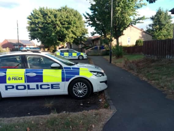 Police remain at the scene in Archdale Close
