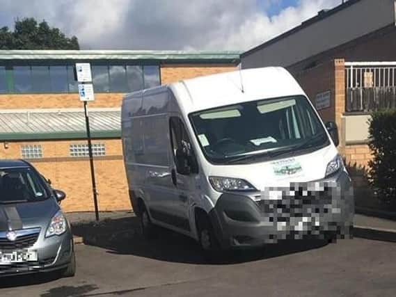 The parked council van.