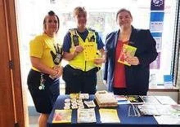 Pictured is PCSO Sarah Dufton, of Ripley Town Centre Safer Neighbourhood Policing Team with Nationwide Building Society staff during a fraud prevention event.