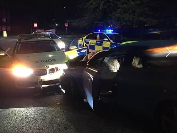 A stolen Volvo crashed into a police car on a roundabout