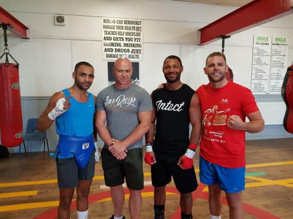 Kid Galahad, Kell Brook and Billy Joe Saunders with trainer Dominic Ingle (second from left) at the Ingle Gym which his father Brendan founded in Wincobank
