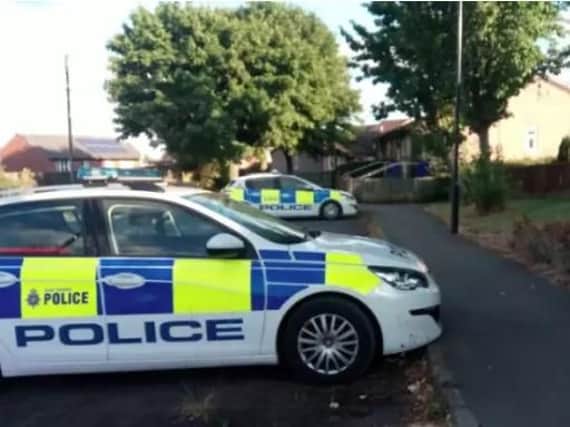 Police officers in Archdale Close, Manor, last week