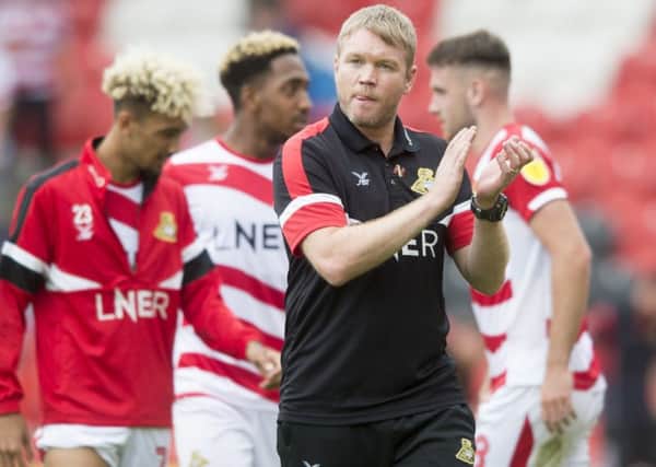 Grant McCann applauds the fans at the end of the game.