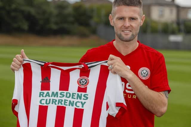 Oliver Norwood is unveiled earlier today