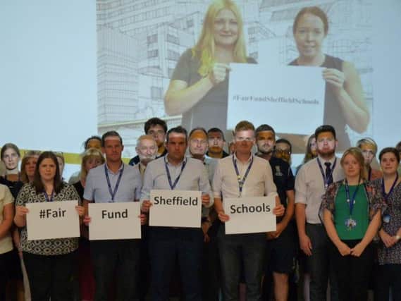 Staff at All Saints Roman Catholic High School show their support the campaign to ensure all city schoolchildren are given their fair share of funding for education
