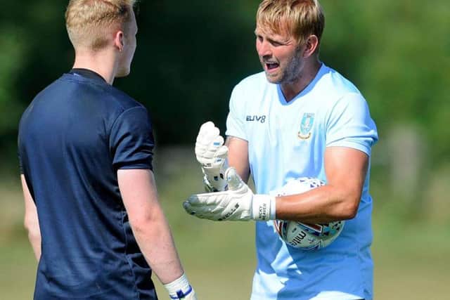 Goalkeeping coach Nicky Weaver, right, with Cameron Dawson in pre-season training.