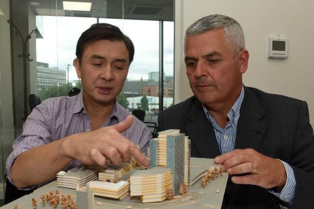 Jerry Cheung and Martin McKervey with a model of the New Era scheme. Picture: Andrew Roe