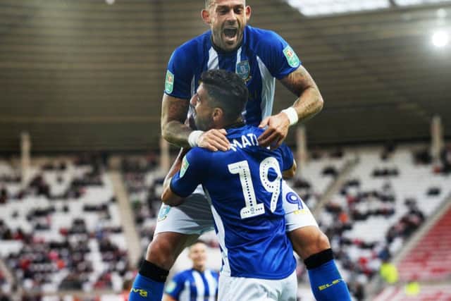 Steven Fletcher celebrates with goal-scorer Marco Matias.
