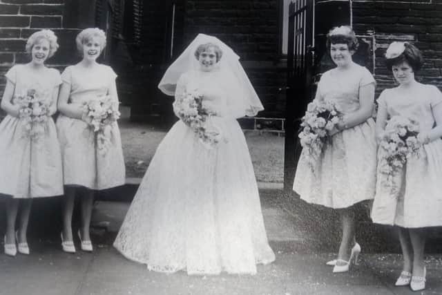 The bride poses with her four bridesmaids on her wedding day.