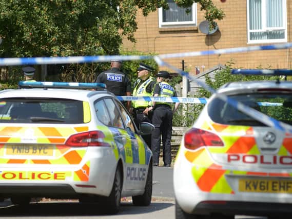 Police on Langsett Close in Sheffield, where a 21-year-old man was stabbed on Tuesday evening