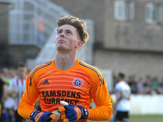 Dean Henderson looks up to the heavens