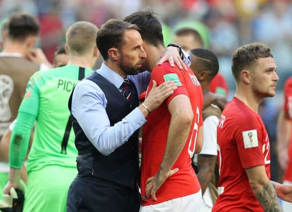 England manager Gareth Southgate (left) consoles Harry Maguire after the FIFA World Cup third place play-off match at Saint Petersburg Stadium.