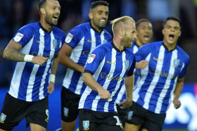 Barry Bannan wheels away in celebration after his fine volley.