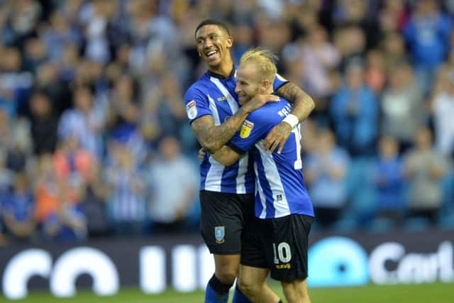 Liam Palmer congratulates Barry Bannan after his opener.