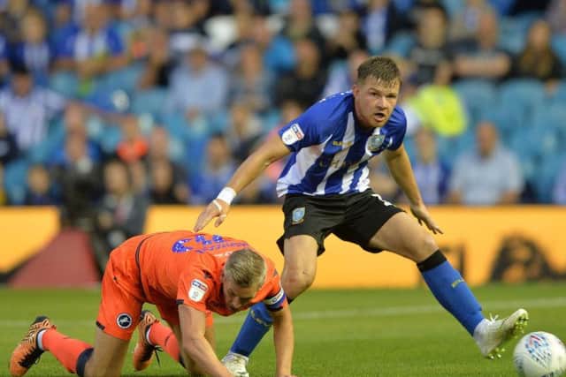 Jordan Thorniley beats Steve Morison to the ball.