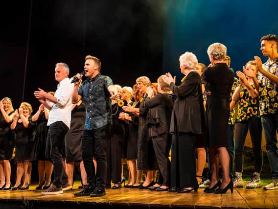 Gary Barlow and Tim Firth, on his left, with real Calendar Girls and the cast on stage at the end of the Leeds Grand Theatre show