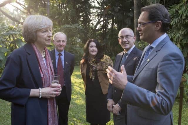 Prime Minister Theresa May chats to The Floows chief executive Aldo Monteforte