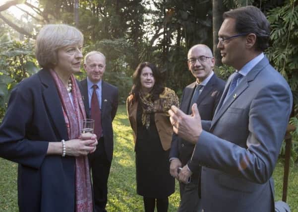 Prime Minister Theresa May chats to The Floows chief executive Aldo Monteforte