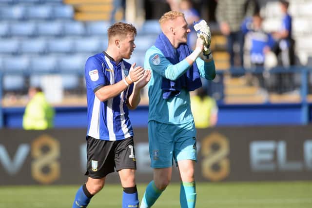 Jordan Thorniley applauds fans with goalkeeper Cameron Dawson
