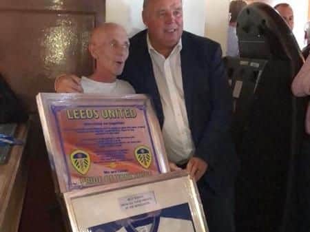 Mel presented Brian with the signed shirt amongst other things