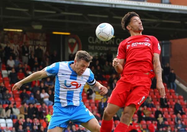 Picture by Gareth Williams/AHPIX.com; Football; Vanarama National League; Leyton Orient v Hartlepool United; 16/09/2017 KO 15.00; Matchroom Stadium; copyright picture; Howard Roe/AHPIX.com; Carl Magnay heads clear from Macauley Bonne