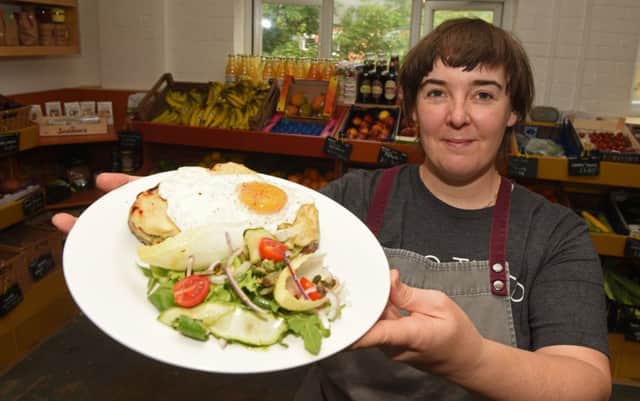 Laura Bullock with their rarebit served with a fried egg and salad at Seven Hills Bakery.