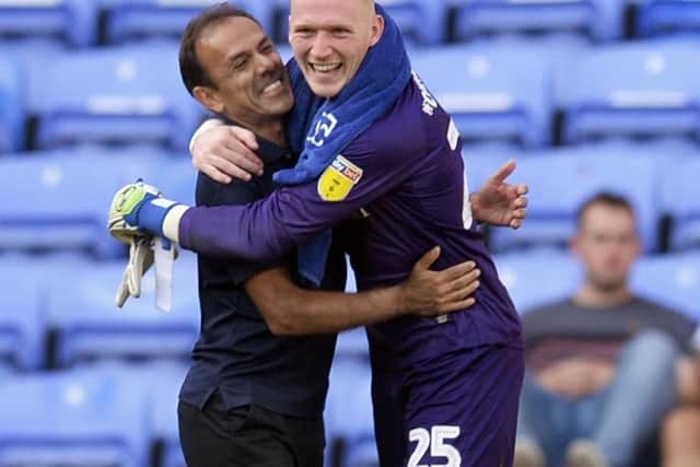 Jos Luhukay embraces goalkeeper Cameron Dawson after the win at Reading