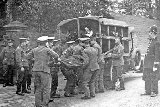 Wounded soldiers being taken from an ambulance to the Base Hospital on Collegiate Crescent. Courtesy of Picture Sheffield