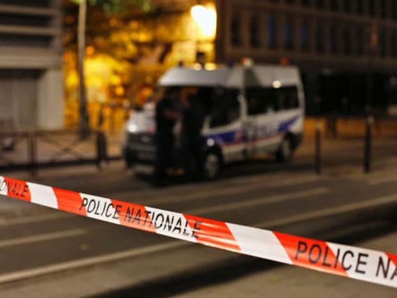 Several people were injured in a knife attack in central Paris late Sunday but police said that terrorism was not suspected. (AP Photo/Thibault Camus)
