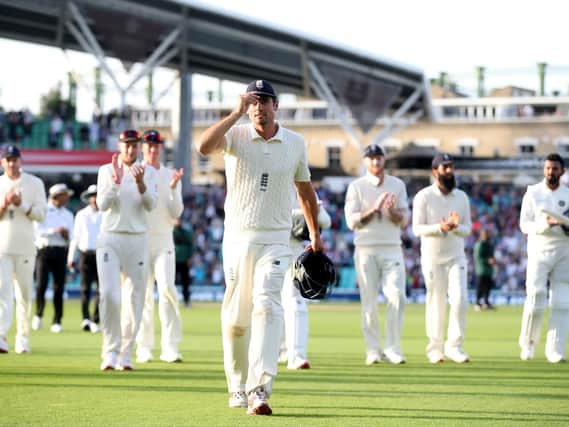 England's Alastair Cook leads the players off at the end of day four