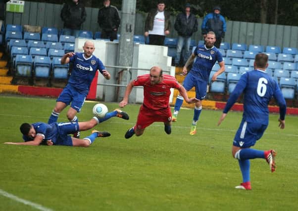 Alfreton's Tom Denton's flying header was saved by the keeper.