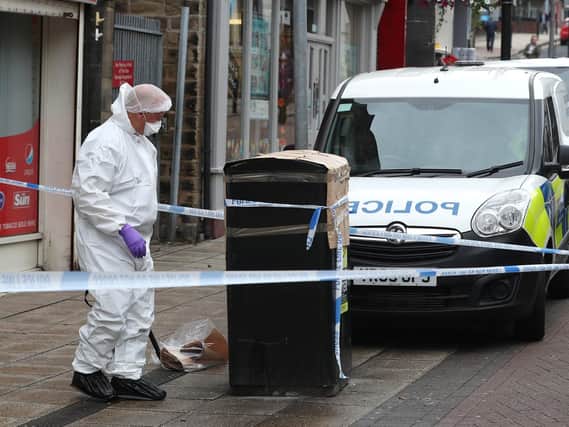 Police in Barnsley town centre, where a man was stabbed on Saturday morning (pic: Danny Lawson/PA Wire)