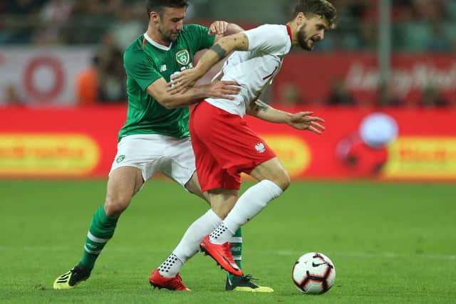 Poland's Mateusz Klich (right) and Republic of Ireland's Sheffield United defender Enda Stevens battle for the ball during the International Friendly at the Stadion Miejski,