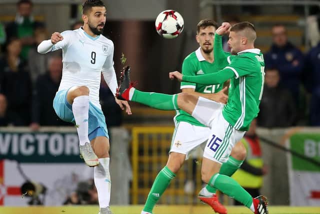 Israel's Moanes Dabour (left) and Northern Ireland's Sheffield United midfielder Oliver Norwood battle for the ball during the International Friendly at Windsor Park, Belfast