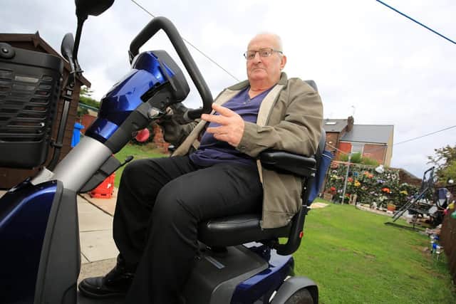 David Irving with his mobility scooter after he was denied service at KFC drive thru in Sheffield.
