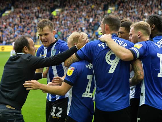 Sheffield Wednesday manager Jos Luhukay joins in the congratulations for Owls scorer Barry Bannan after his equaliser