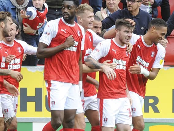 Rotherham's Ryan Manning is congratulated after scoring from the penalty spot