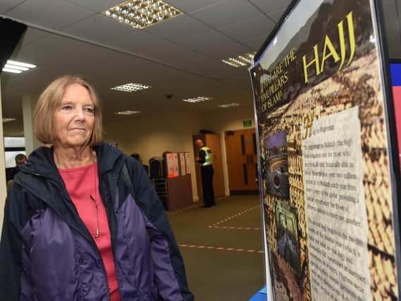 Sue Bell looks at the exhibits on display at the Madina Masjid Mosque Open Day. Picture: Andrew Roe.